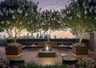Rooftop amenity terrace at Frankford Grand at dusk