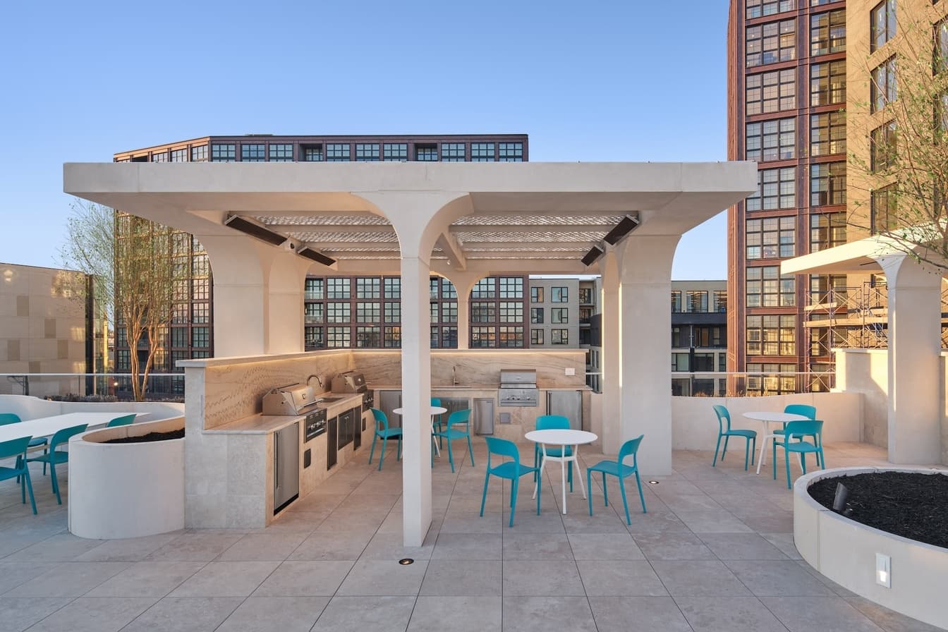 Rooftop amenity deck with outdoor kitchen at Piazza Alta, plumbed by Plumbing Resolution